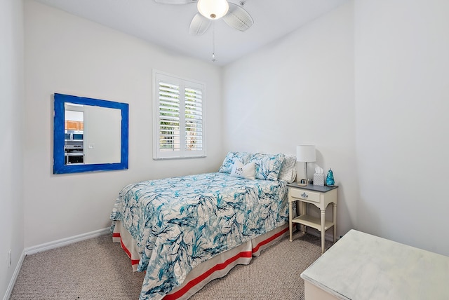 bedroom with ceiling fan and carpet floors