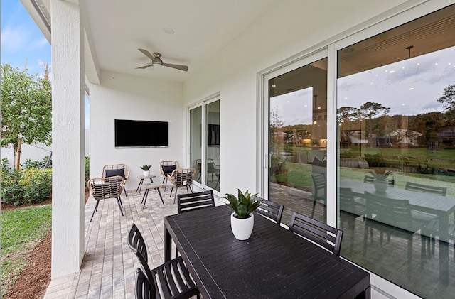 view of patio / terrace featuring ceiling fan, outdoor dining area, and outdoor lounge area