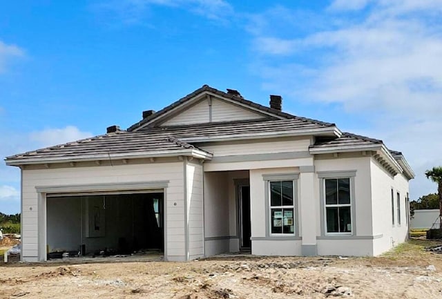 view of front of property with a garage