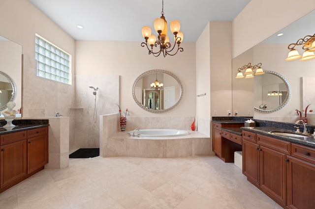 bathroom featuring independent shower and bath, a notable chandelier, and vanity