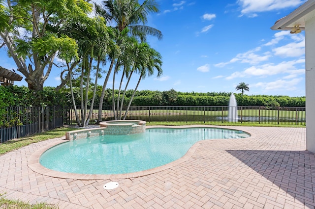 view of pool with an in ground hot tub and a patio area