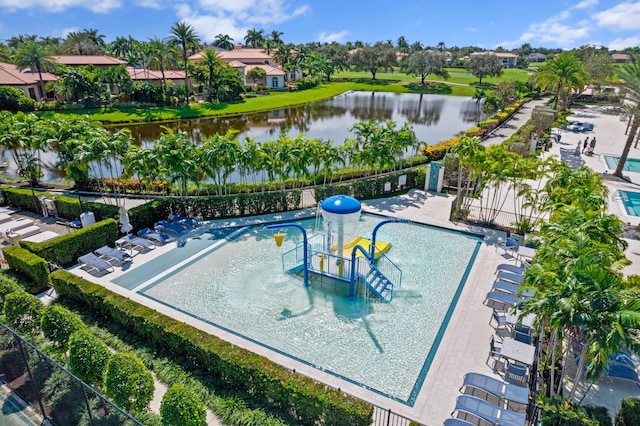 view of swimming pool with a water view