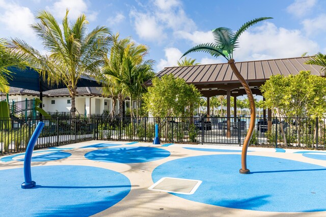 view of pool featuring a patio and an in ground hot tub