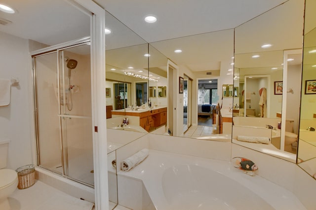 full bathroom featuring vanity, toilet, separate shower and tub, and tile patterned flooring