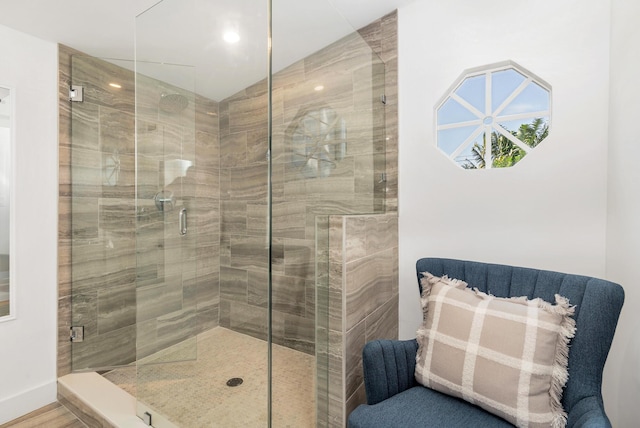 bathroom with a shower with shower door