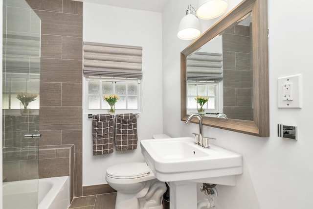 bathroom with tile patterned flooring and toilet