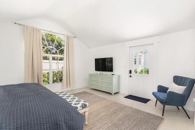 carpeted bedroom with vaulted ceiling