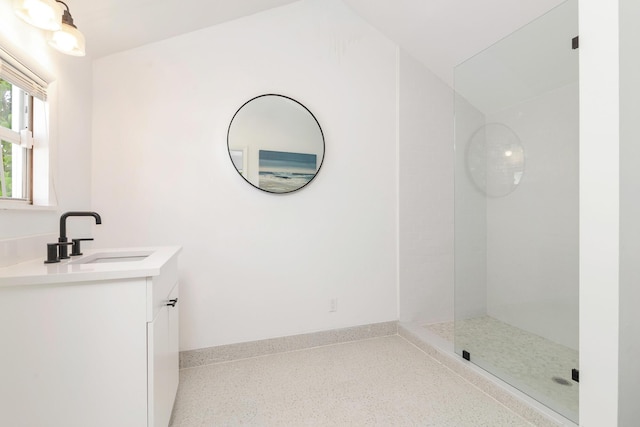 bathroom with a shower and vanity