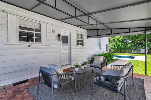 view of patio / terrace with outdoor lounge area and a pool