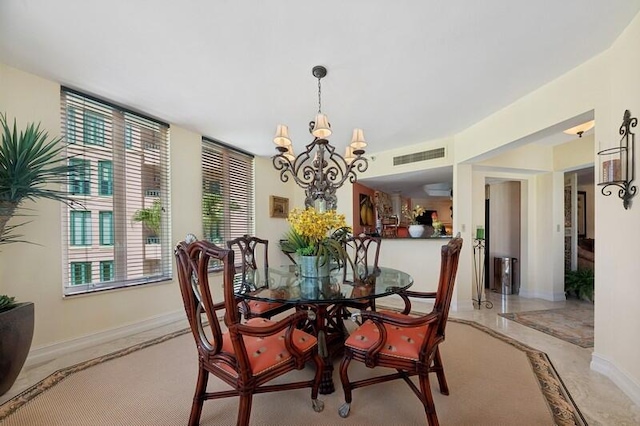 dining space featuring a chandelier