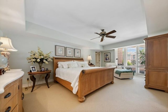 carpeted bedroom with ceiling fan and access to exterior