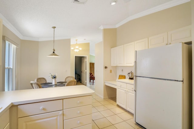 kitchen featuring crown molding, white cabinetry, hanging light fixtures, light tile patterned flooring, and white fridge