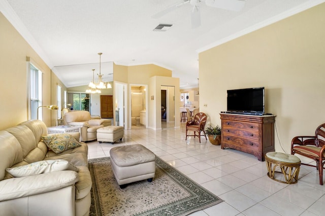 living room featuring light tile patterned floors, ceiling fan with notable chandelier, vaulted ceiling, and ornamental molding