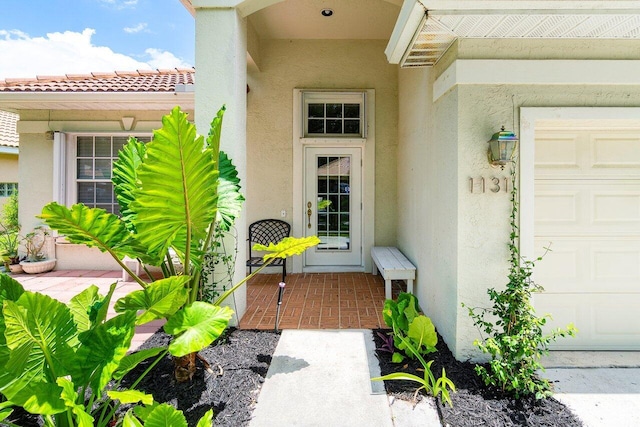 entrance to property featuring a garage