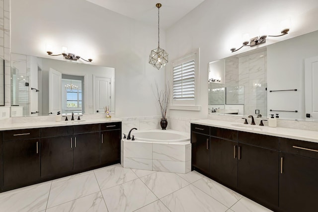 bathroom with plus walk in shower, vanity, and an inviting chandelier