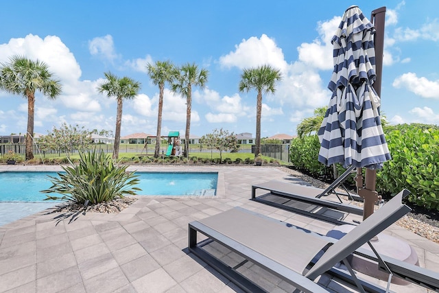 view of swimming pool with a patio area