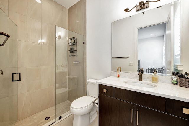 bathroom with vanity, toilet, and an enclosed shower