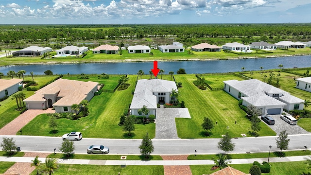 birds eye view of property with a water view