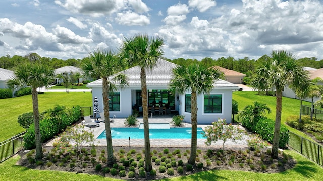 view of swimming pool featuring a lawn and a patio area