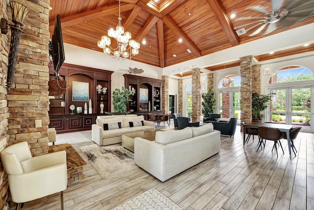 living room featuring wooden ceiling, high vaulted ceiling, french doors, ceiling fan with notable chandelier, and beam ceiling