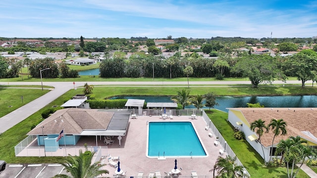 view of swimming pool featuring a water view