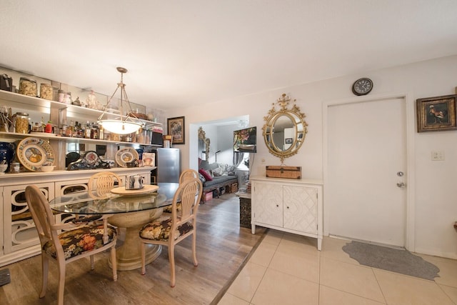 dining area featuring light wood-type flooring