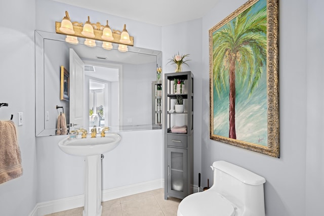 bathroom featuring tile patterned floors and toilet