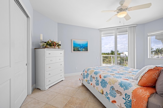 tiled bedroom featuring access to outside, ceiling fan, and a closet