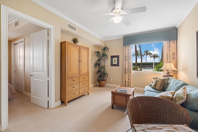 sitting room with ceiling fan and ornamental molding