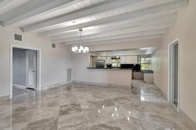 unfurnished living room featuring a notable chandelier, beam ceiling, and wood ceiling