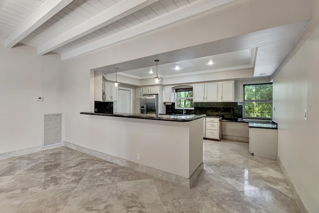 kitchen with stainless steel fridge with ice dispenser, decorative light fixtures, white cabinetry, decorative backsplash, and kitchen peninsula