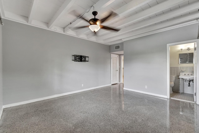 spare room with sink, beam ceiling, and ceiling fan