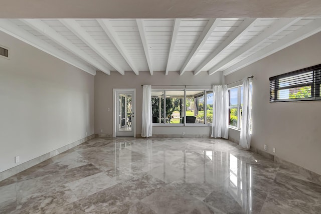 spare room with beam ceiling