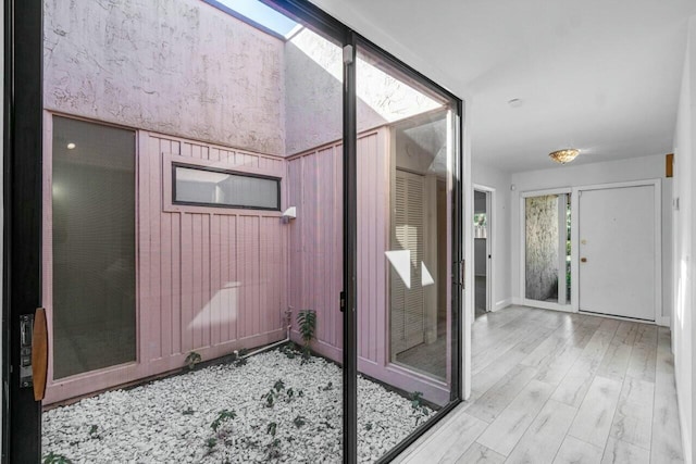 bathroom with hardwood / wood-style flooring