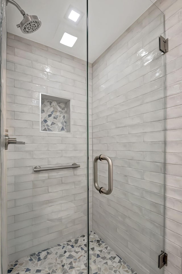 full bath featuring a shower stall