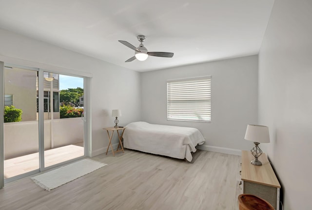 bedroom featuring access to outside, light wood finished floors, a ceiling fan, and baseboards