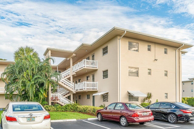 view of property with uncovered parking