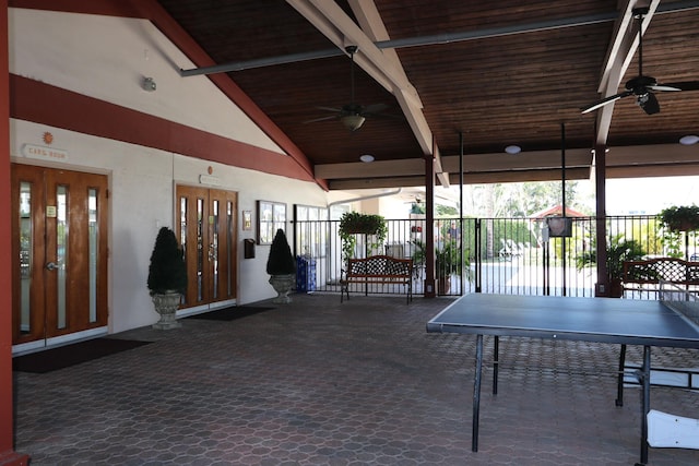 exterior space featuring high vaulted ceiling, beam ceiling, dark carpet, and wooden ceiling