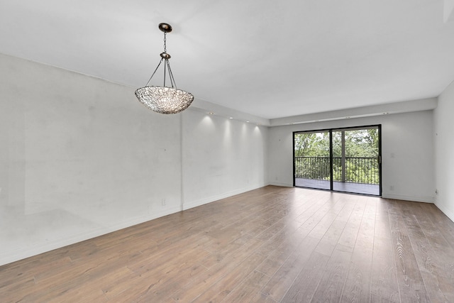 unfurnished room featuring wood-type flooring