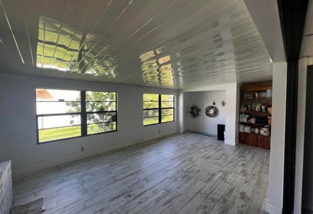 unfurnished living room featuring hardwood / wood-style floors