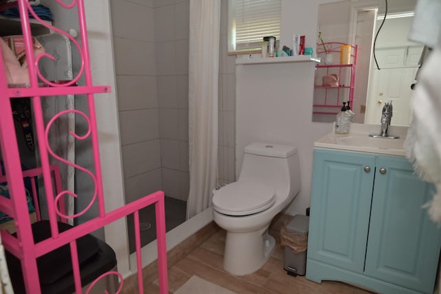 bathroom featuring vanity, a shower with curtain, and toilet