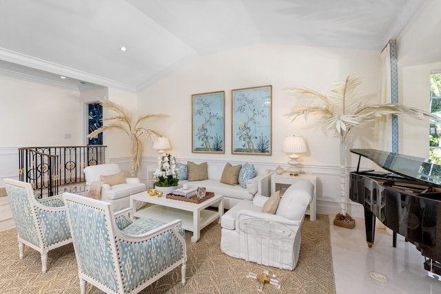 living room featuring lofted ceiling and ornamental molding