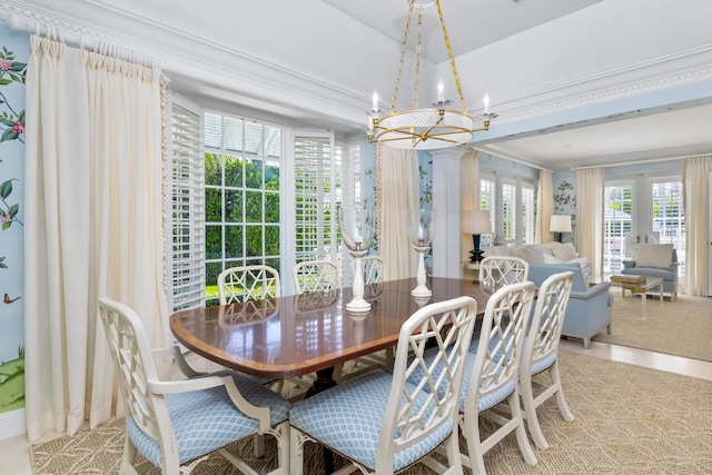 dining room featuring a notable chandelier and ornamental molding