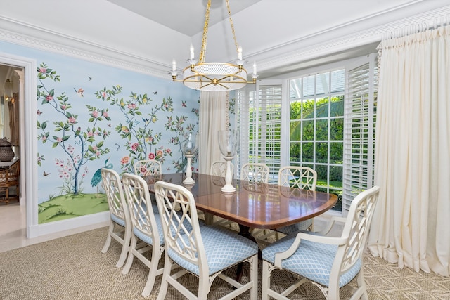 dining area with a chandelier and baseboards