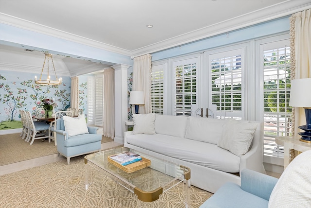 living room featuring an inviting chandelier and crown molding