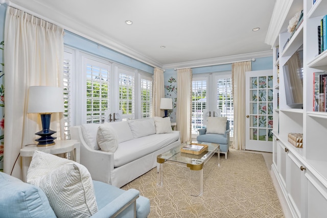 living room featuring french doors, light carpet, and ornamental molding