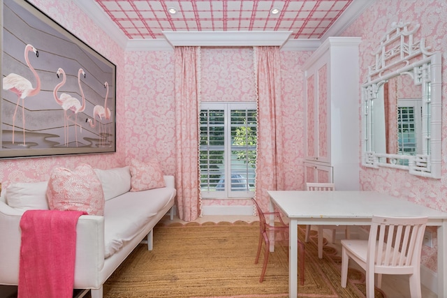 dining space with wallpapered walls, crown molding, and an ornate ceiling