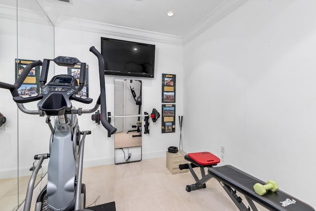 workout room with tile patterned floors, baseboards, and ornamental molding