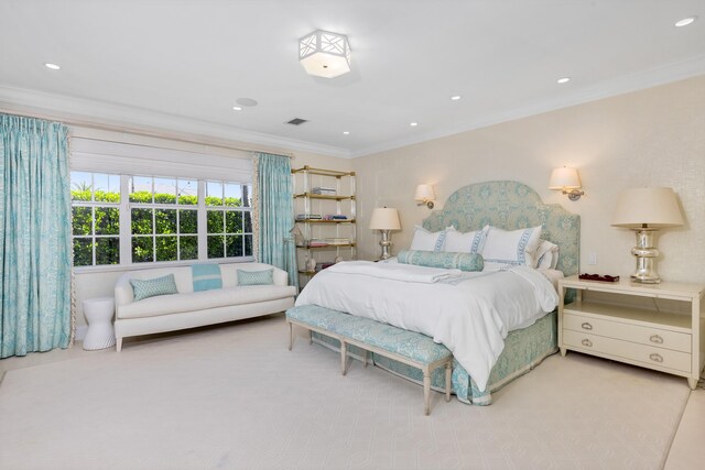 bedroom with crown molding and light colored carpet