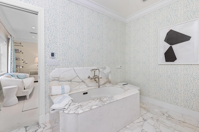 bathroom with a garden tub, marble finish floor, crown molding, and wallpapered walls